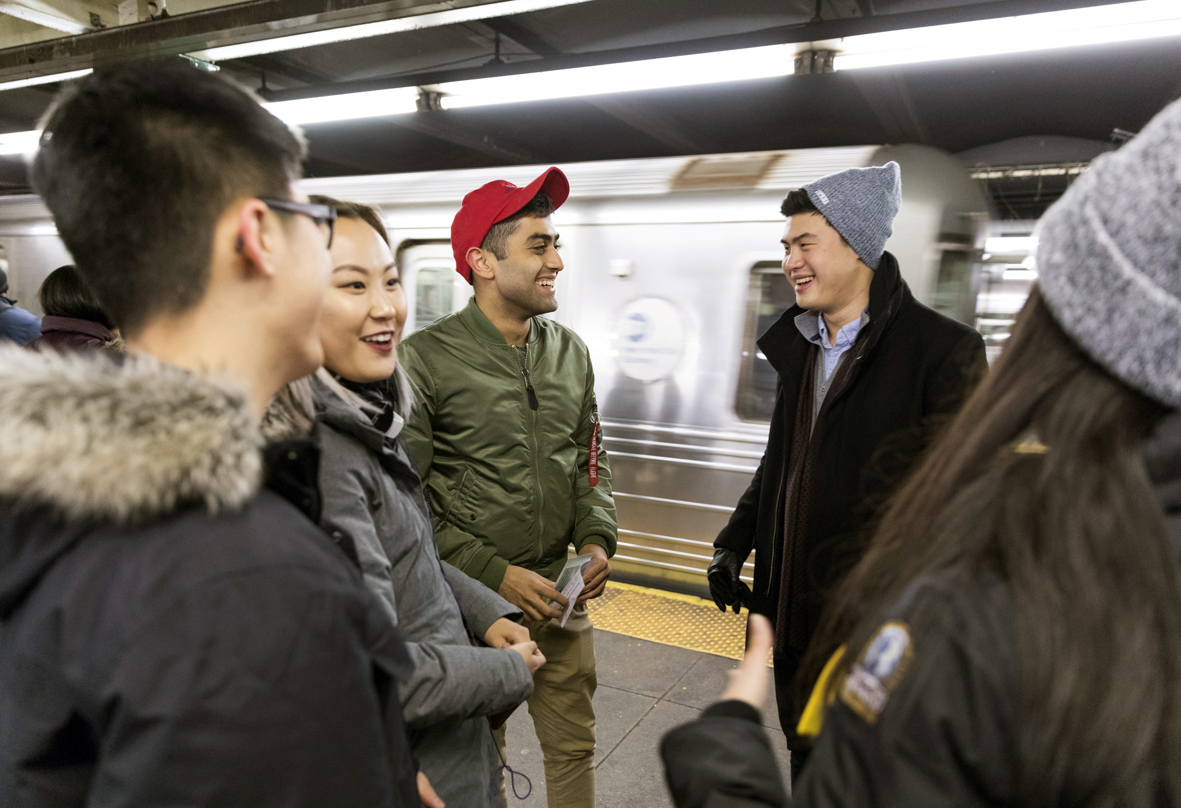Group of students on a subway platform